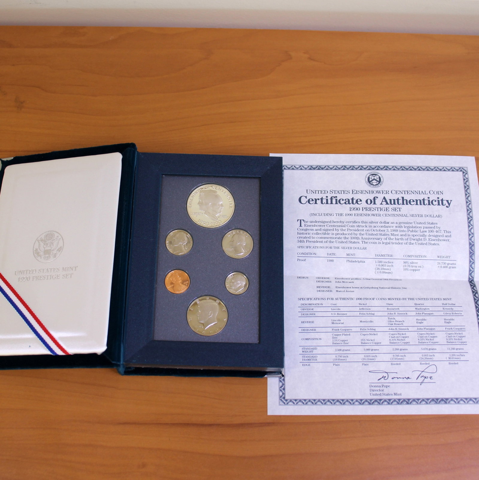 US Mint 1990 Prestige Set: Proof set. Contains 6 coins. 1990 Eisenhower Centennial Dollar is 90% silver. Includes holder and docs.