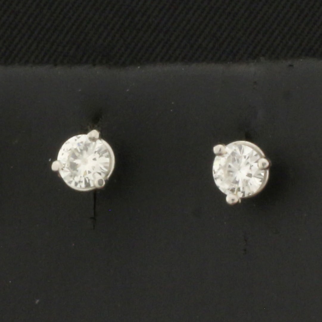 1/3ct Diamond Stud Earrings in Platinum Martini Settings: In platinum martini settings. Contains two high quality Round Brilliant Diamonds, 1/3ct TW, SI1 clarity/H color, eye clean, great cut for lots of sparkle. .8g