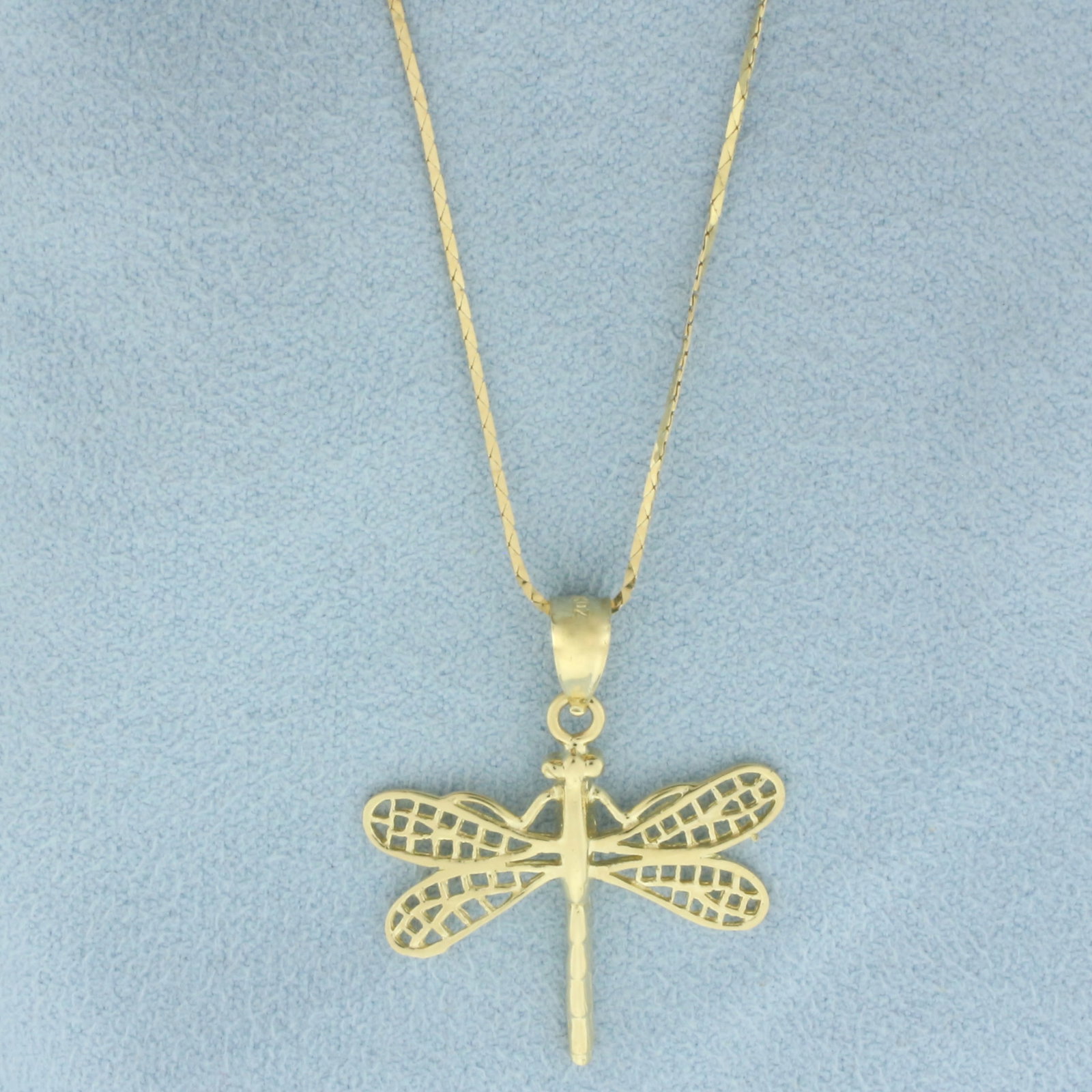 Dragonfly Necklace in 14k Yellow Gold: In 14k yellow gold. Cobra link chain is 18.5 inches long, .6mm thick, spring clasp. Pendant is 1 1/8 inches long (including bale) and 1 inch wide. 2.7g.