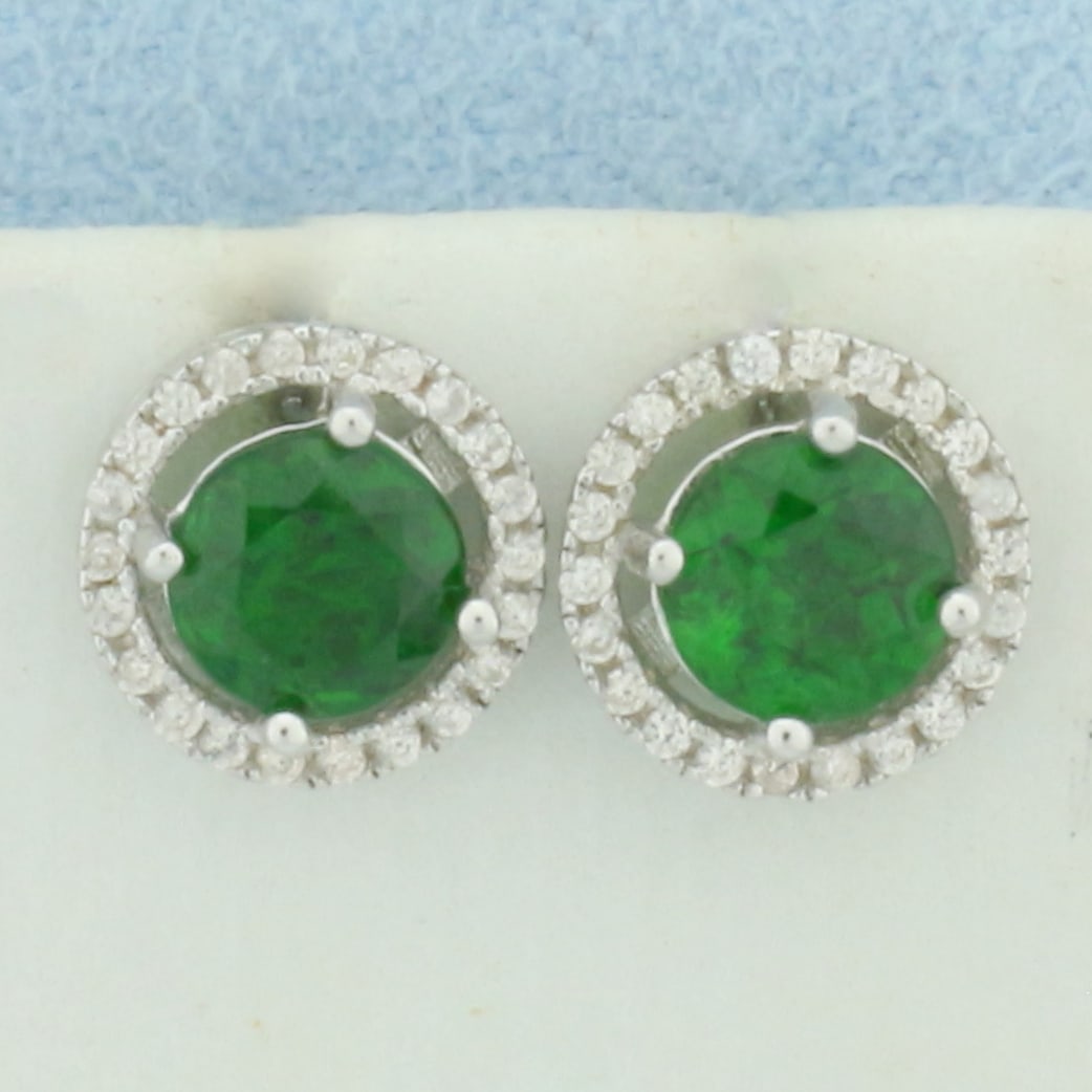 Green Chrome Diopside and White Zircon Halo Earrings in Sterling Silver: In .925 sterling silver. Contains two high quality natural chrome diopside gemstones, 2ct TW, with intense color. Also contains .31ct TW of high quality White Zircon gemstones. Friction backs. 2.1g.