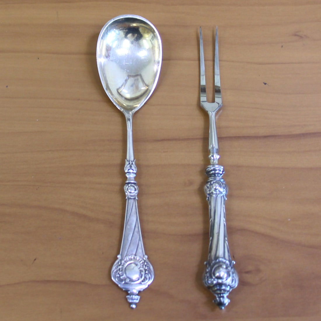 Antique Silver Meat Fork and Serving Spoon: In 80% fine silver. Contains one meat fork, 7.5 inches, and one berry serving spoon, 7.25 inches. 74.7g.
