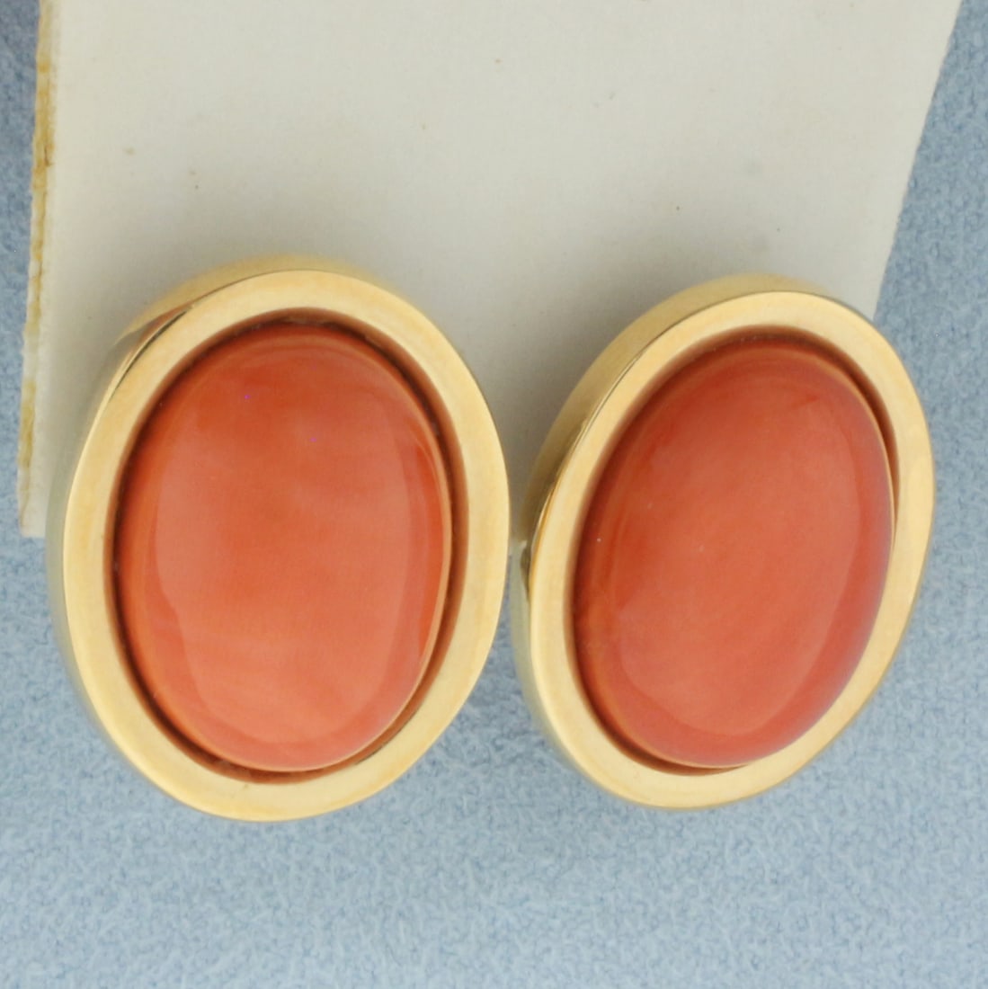Vintage Red Coral Button Earrings in 14k Yellow Gold: In 14k yellow gold. Contains two high quality 21mm by 16mm red coral gemstones. 1 inch long and 3/4 inch wide. Omega backs.