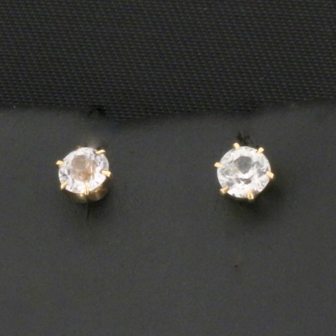 Antique Old European Cut White Sapphire Stud Earrings in 14k Yellow Gold: In 14k yellow gold. Contains two high quality 1/5ct Old European Cut White Sapphire gemstones with excellent clarity. Screw backs. .9g.