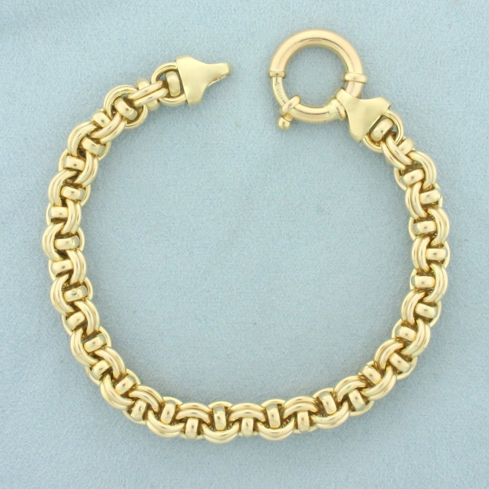 Italian Double Rolo Link Bracelet in 14k Yellow Gold: In 14k yellow gold. Italian made. 8 inches long. 8mm wide. Oversized decorative spring clasp. 19.8g.