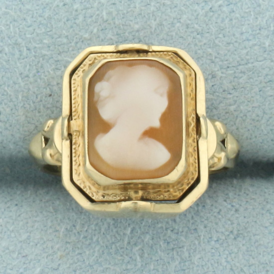 Antique Spinning Shell Carved Cameo and Onyx/Diamond Ring in 14k Yellow Gold: In 14k yellow gold. Face of ring spins to show one of two sides. First side contains one high quality 10mm by 8mm hand carved shell womens cameo. Other side contains 10mm by 8mm Onyx plaque and .01ct 