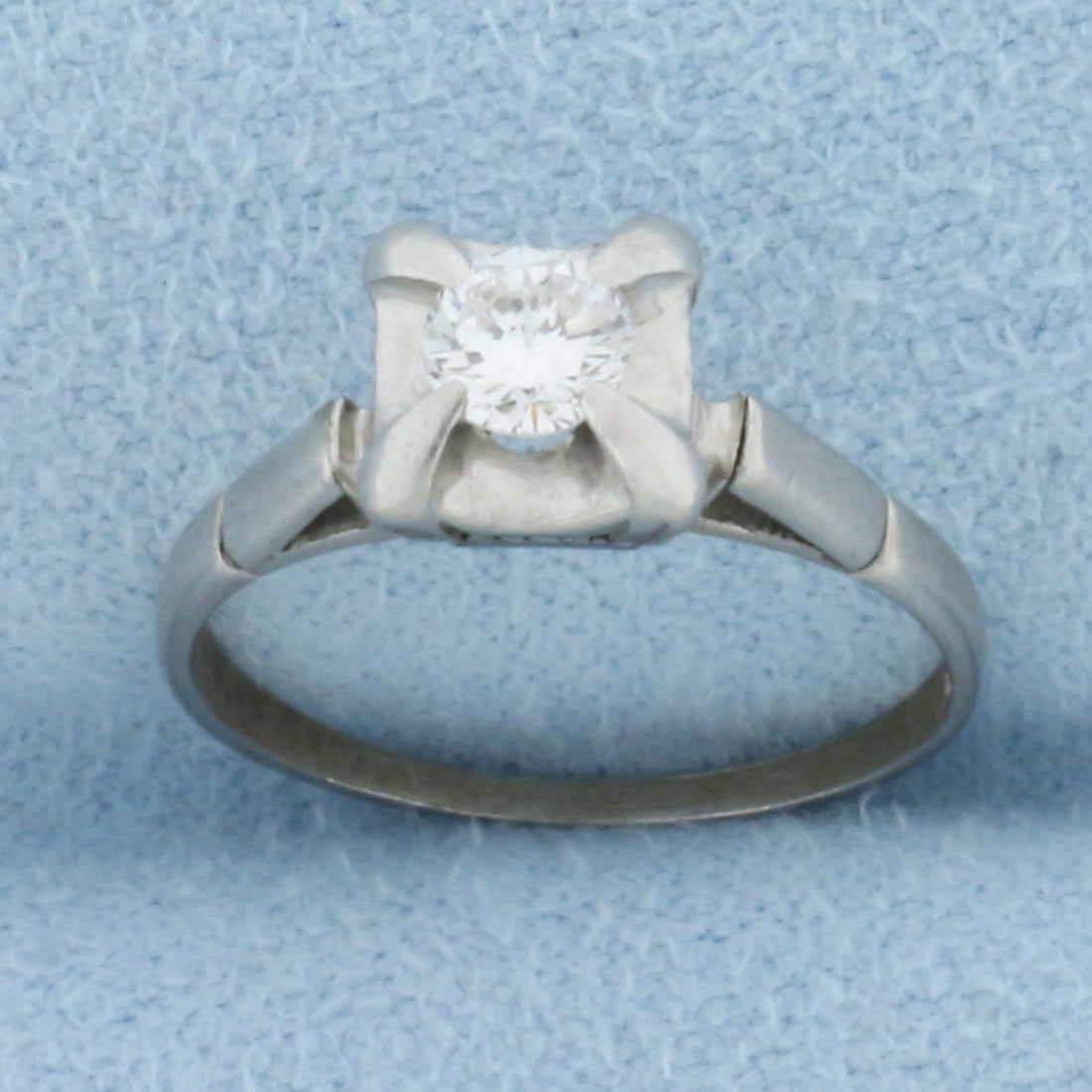 Vintage Diamond Solitaire Engagement Ring in Platinum: In platinum. Contains one high quality 1/4ct round brilliant diamond, VS clarity/F color, excellent cut for lots of sparkle. Size: 3.75. 2.6g.