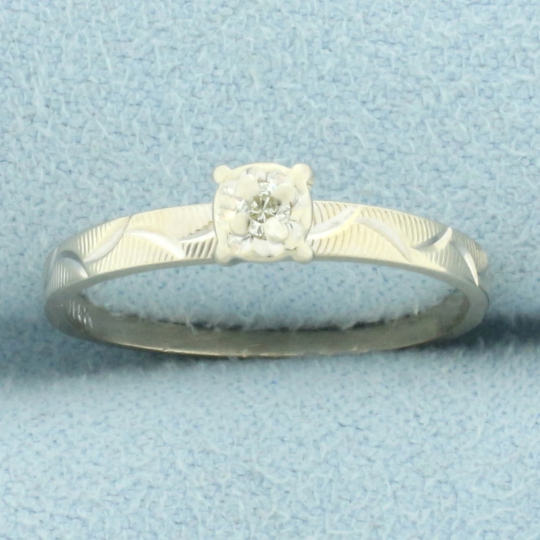 Diamond Solitaire Engagement or Promise Ring in 14k White Gold: In 14k white gold. Contains one high quality .03ct diamond, SI clarity/I color. Size: 6. 1.4g.