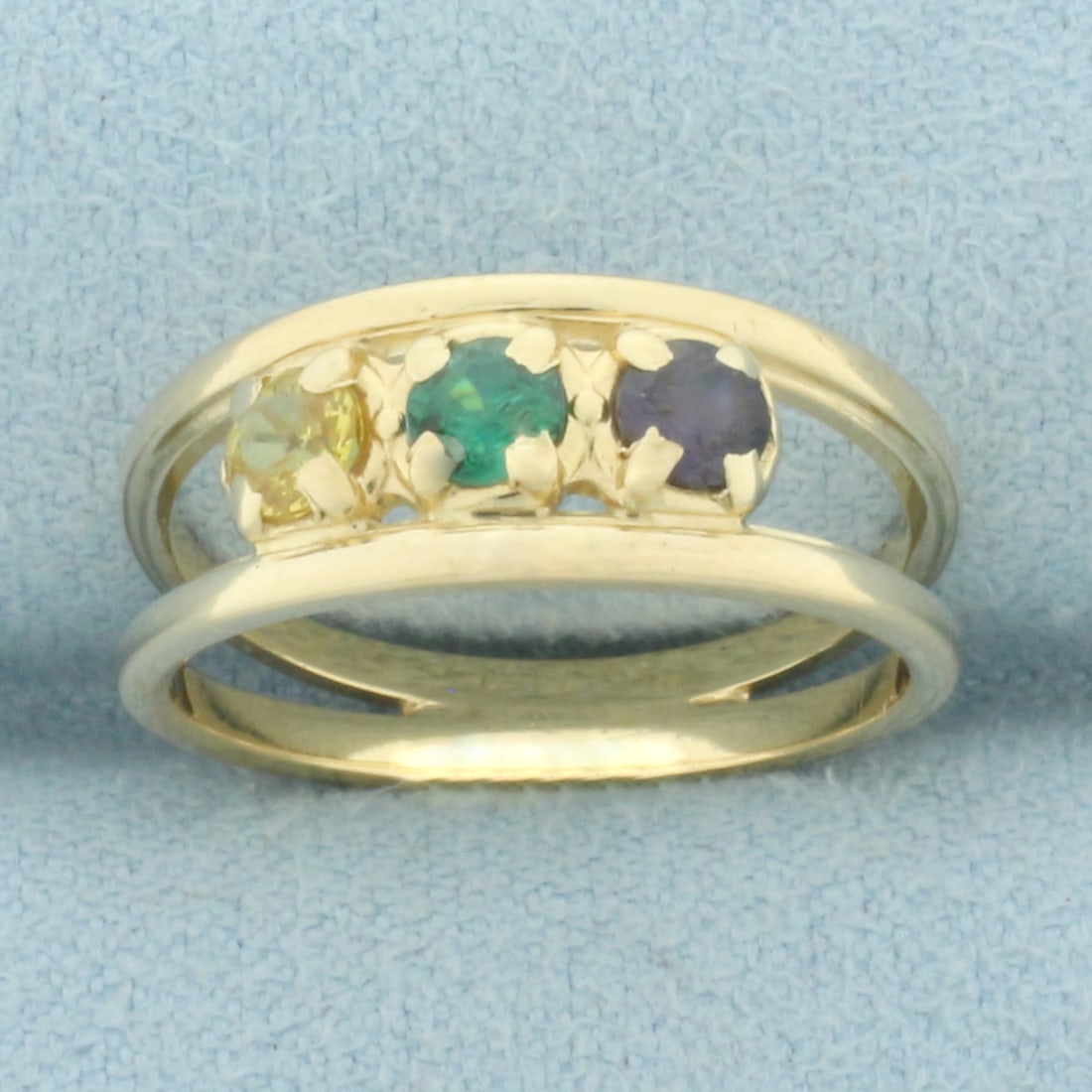 Topaz Split Shank Ring in 14k Yellow Gold: In 14k yellow gold. Contains high quality natural 3.5mm yellow, green, and purple topaz gemstones with vibrant color. Size: 6.25. 3.0g.