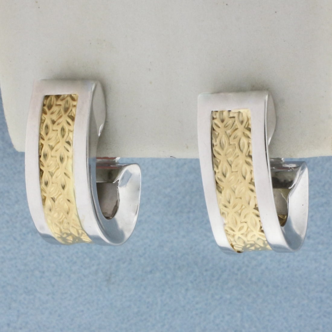 Two Tone J-Hoop Earrings in 14k Yellow and White Gold: In 14k Yellow and White Gold. 3/4 inches by 1/2inch. 8mm inch wide. Omega backs. 4.7g.