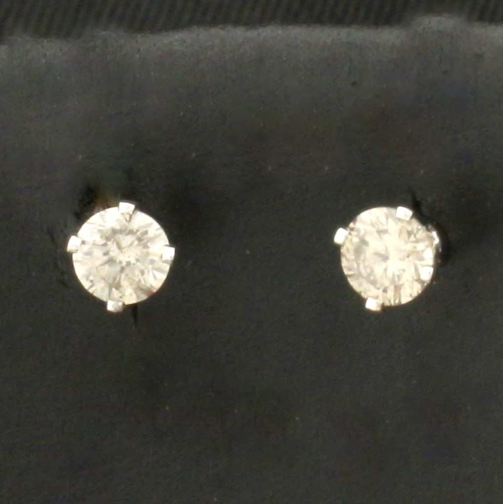 Diamond Stud Earrings in 14k White Gold: In 14k White Gold. Contains two high quality round brilliant diamonds, 1/3ct TW, I color/I clarity. Friction backs. .4g.