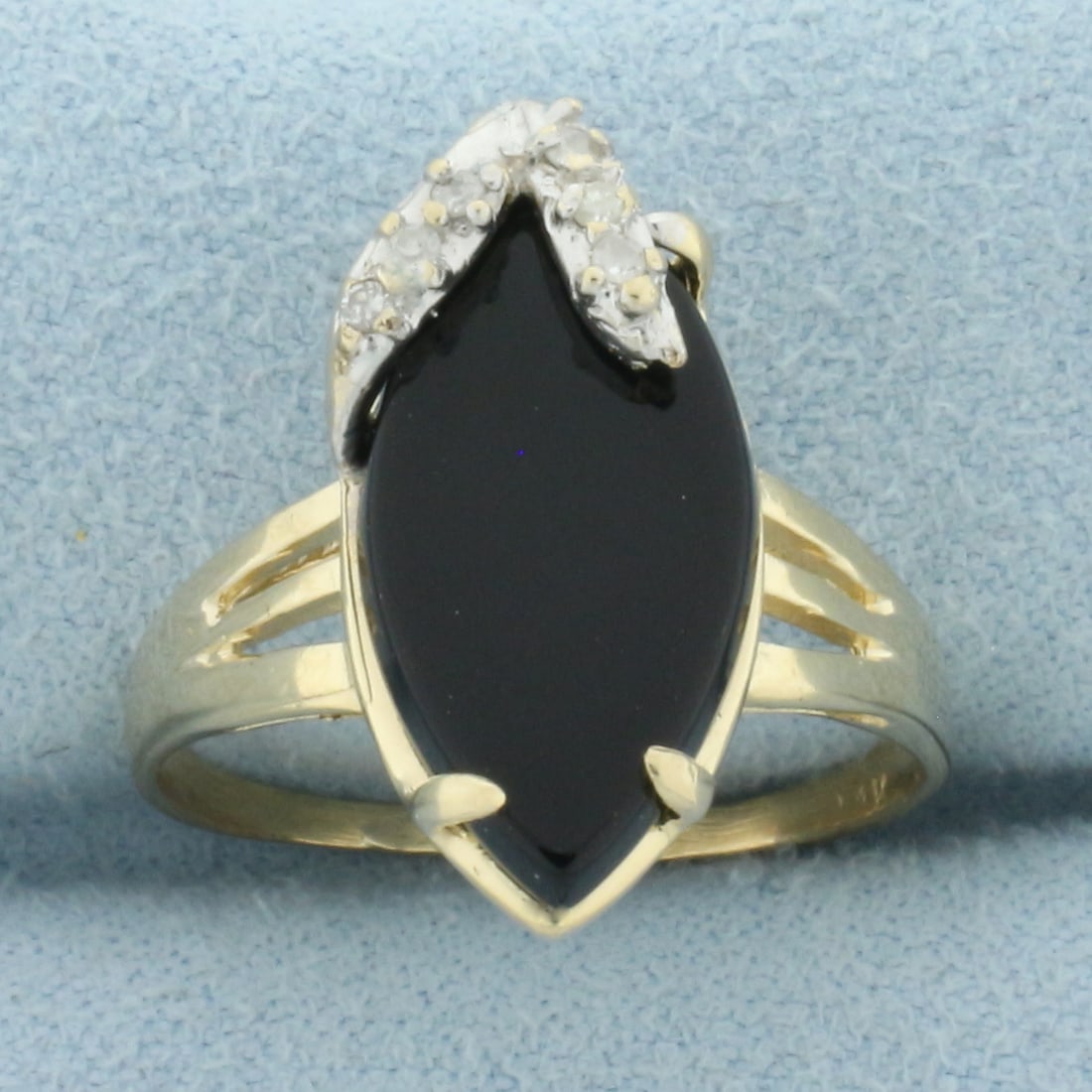 Onyx and Diamond Ring in 14k Yellow Gold: In 14k yellow gold. 18mm by 9mm onyx plaque. Also contains six high quality .01ct diamonds, I color/I clarity. Size: 7.5. 3.3g.