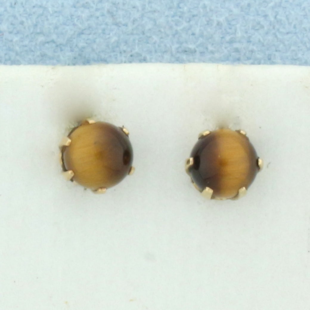 Tiger's Eye Stud Earrings in 14k Yellow Gold: In 14k yellow gold. Italian made. Contains two high quality 4.75mm Tiger's Eye gemstones with very distinct "eye" and beautiful color. Friction backs. .8g.