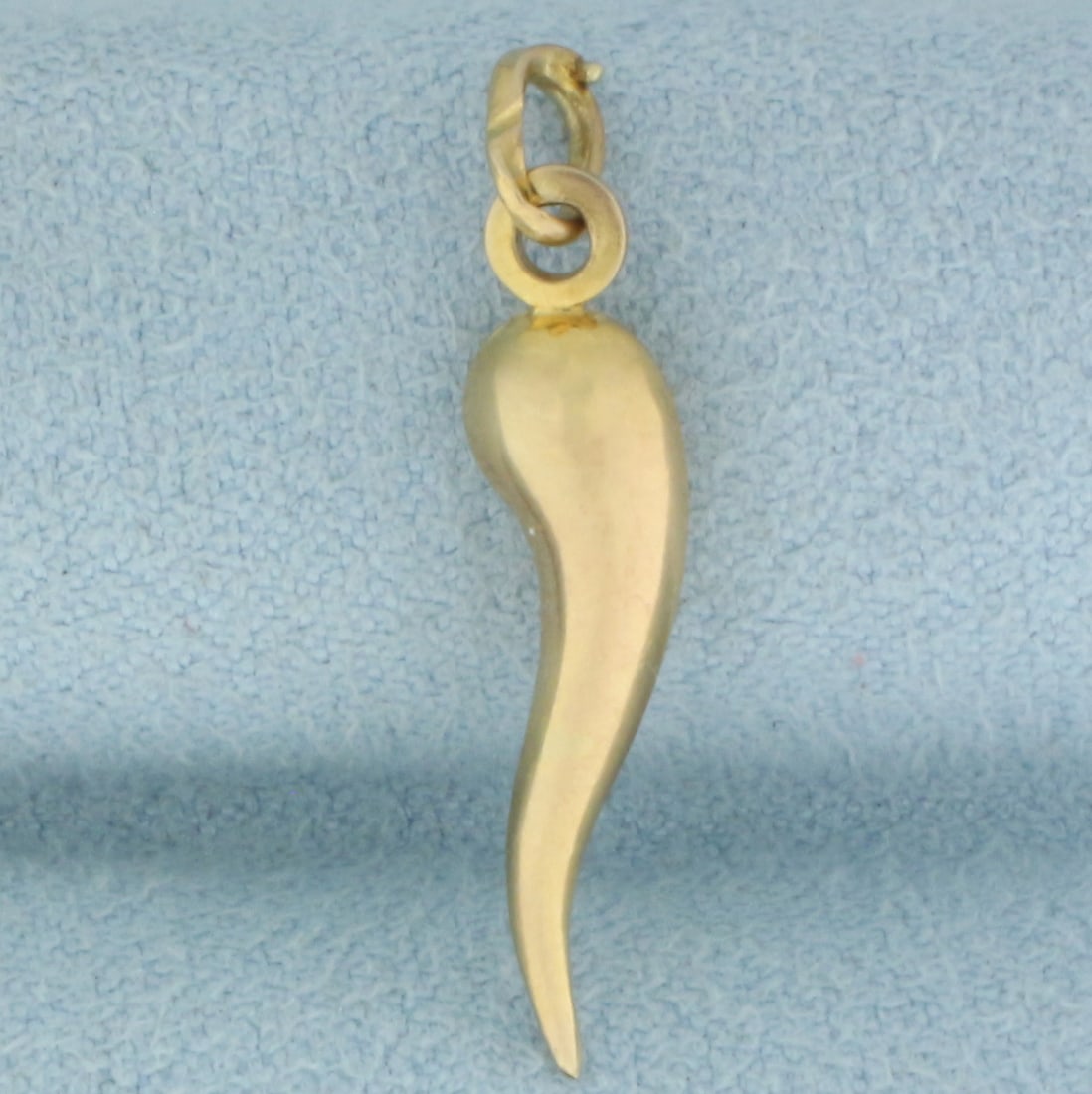 Italian Horn Charm or Pendant in 14k Yellow Gold: In 14k Yellow Gold. 1 inch long. 3/16 inch wide. Italian made. .7g.