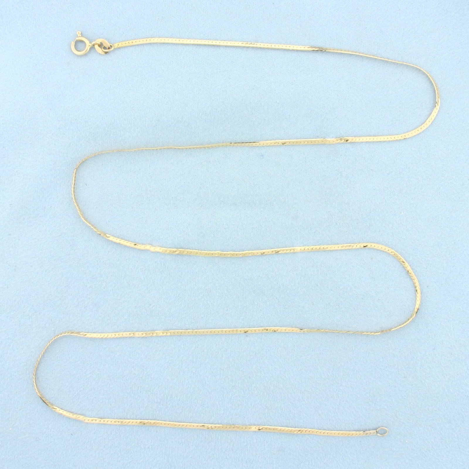 24 Inch Italian Herringbone Link Chain Necklace in 14k Yellow Gold: In 14k Yellow Gold. 24 inch long. 1.5mm wide. Italian made. Spring clasp. 4.1g.