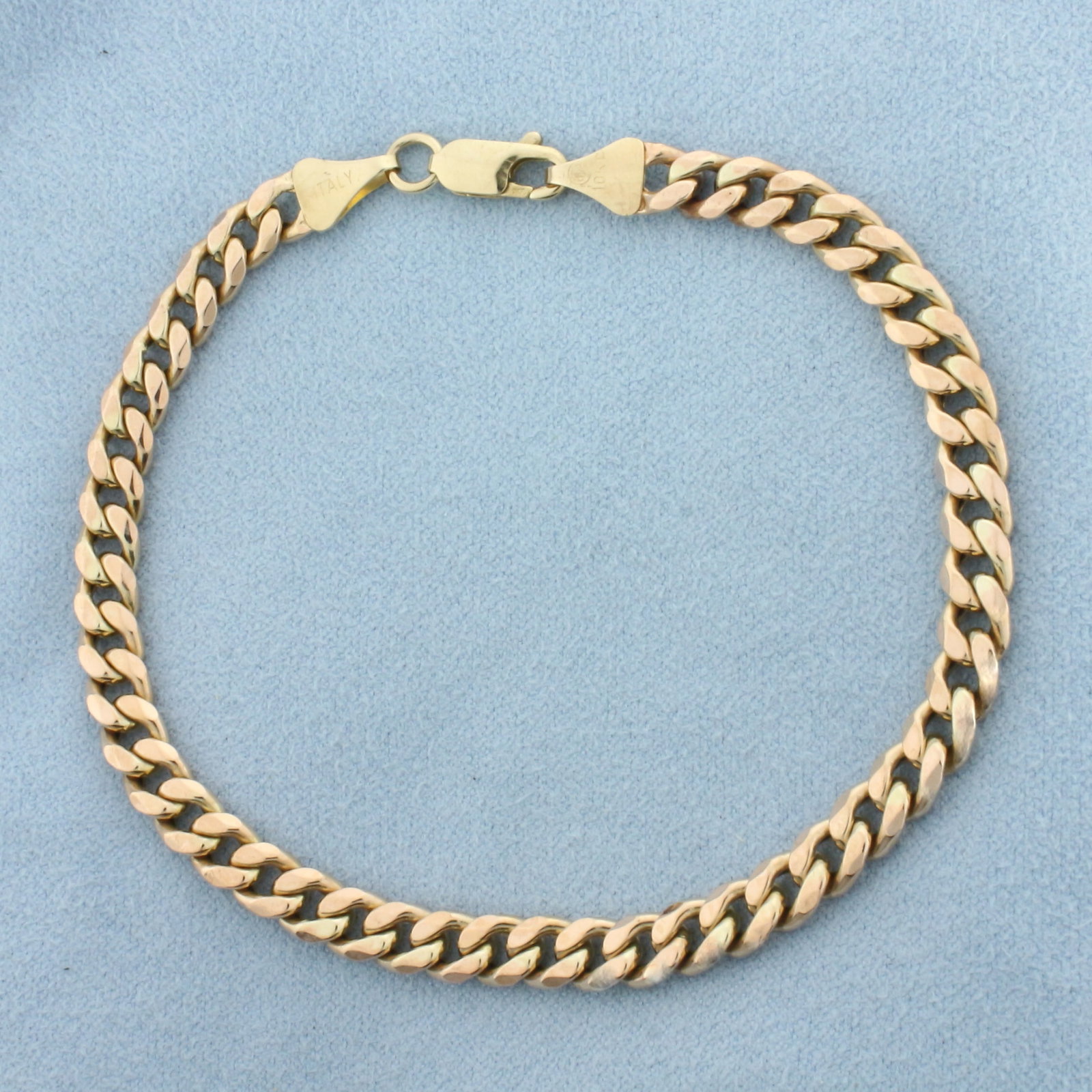 Italian Curb Link Bracelet in 10k Rose Gold: In 10k rose gold. Italian made. 8.5 inch long by 5.5mm wide. Lobster clasp. 7.5g.
