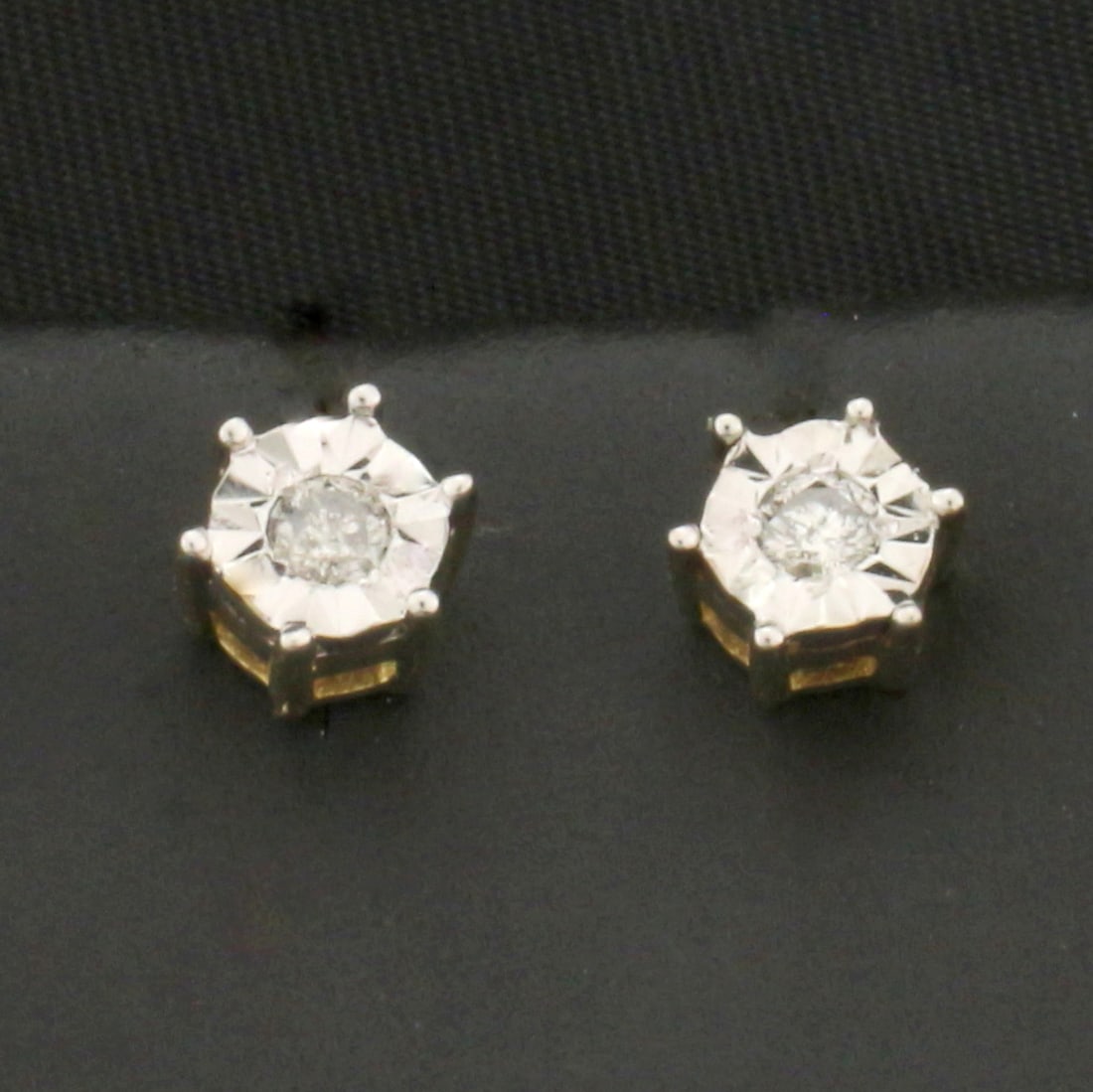 Diamond Stud Earrings in 10k Yellow Gold: In 10k Yellow Gold. Contains two high quality .06ct diamonds, H color/I clarity. Friction backs. 1.2g.