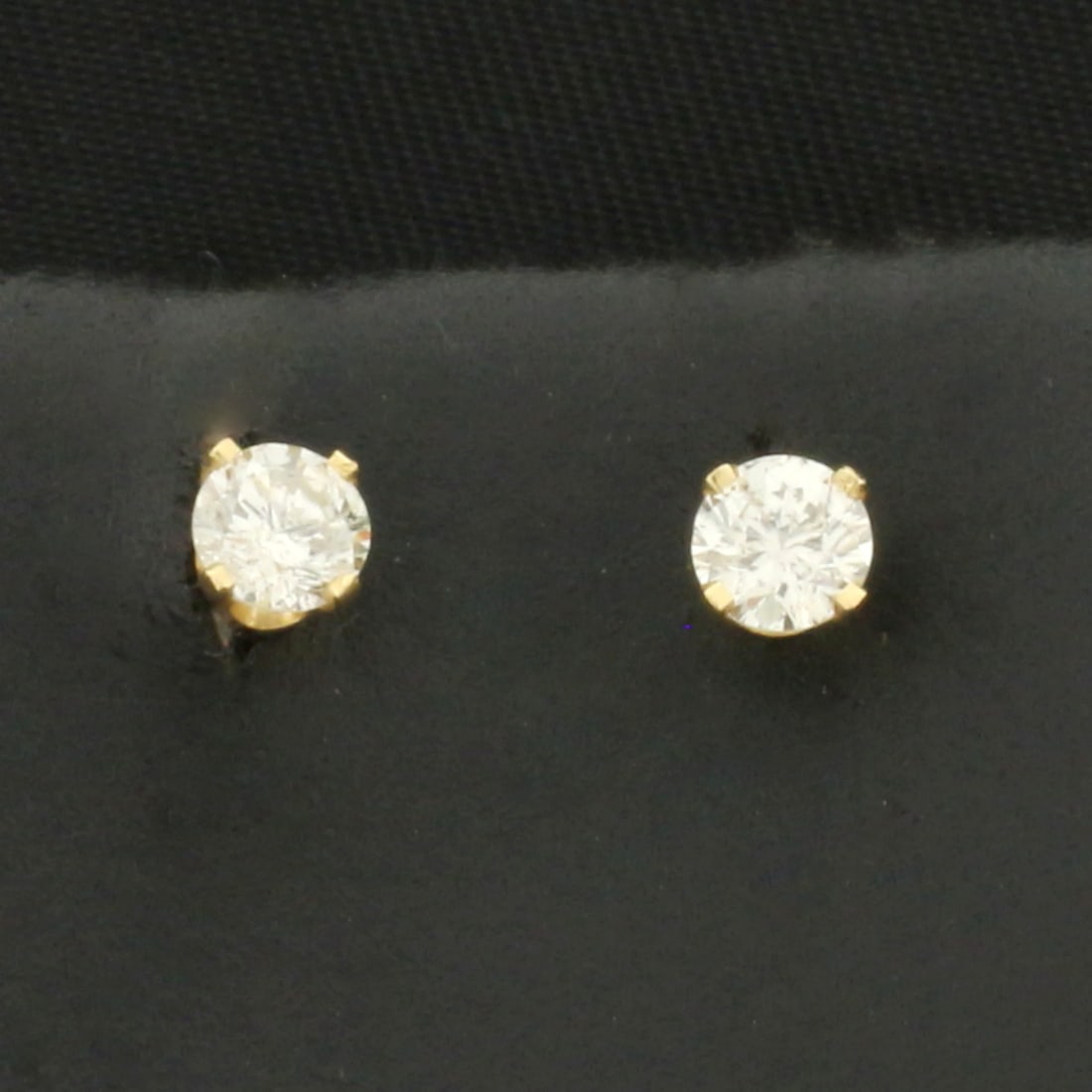 Diamond Stud Earrings in 14k Yellow Gold: In 14k Yellow Gold. Contains two high quality round brilliant diamonds, 1/3ct TW, I color/I clarity, eye clean, great cut for added brilliance. Friction backs.