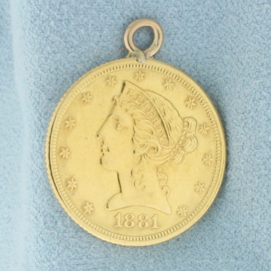 Five Dollar Gold Liberty Head Coin Pendant: 14k Gold Ring. Contains one 1881Five Dollar Gold Liberty Head Coin, 90% pure gold. 1 inch long. 7/8 inch wide. 8.5g.