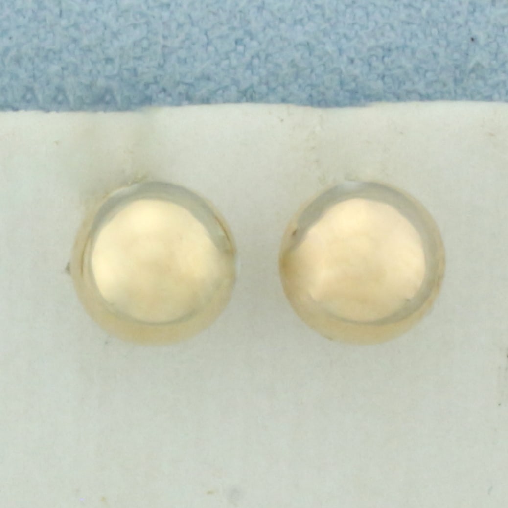 7mm Ball Stud Earrings in 10k Yellow Gold: In 10k Yellow Gold. 7mm ball beads with very small indentation but not noticeable. Friction backs.