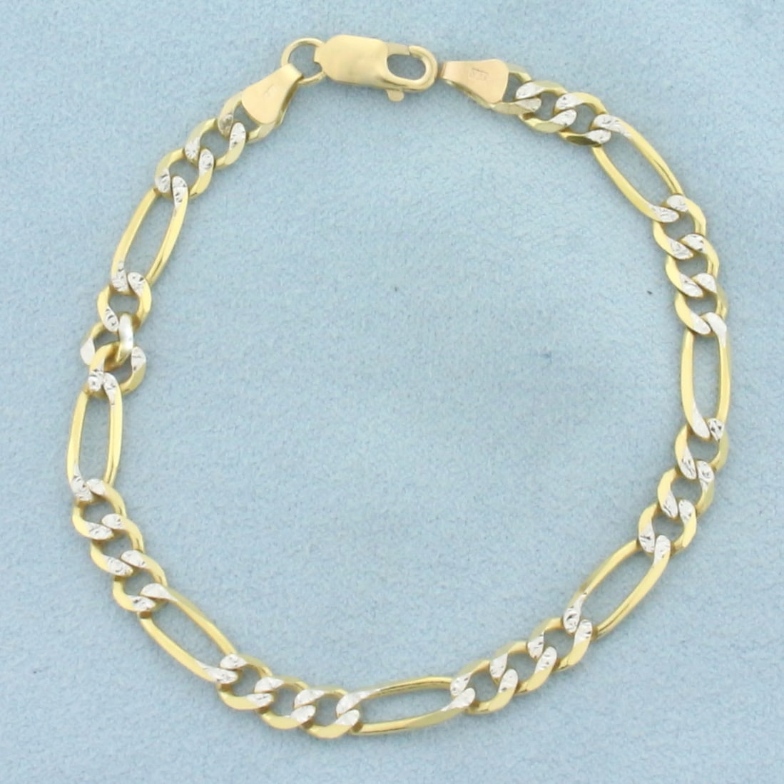 Figaro Link Bracelet in 14k Yellow Gold with 14k White Gold accents: In 14k Yellow Gold with 14k White Gold accents that are meant to give appearance of diamonds. 7 1/8 inch long. 4.8mm wide. Lobster clasp. 6.2g.