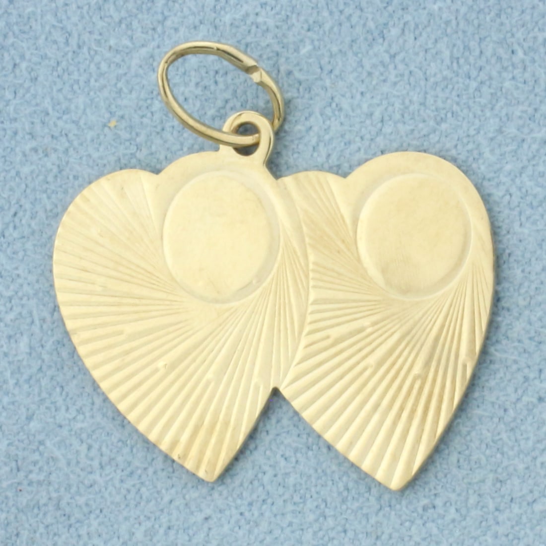 Engravable Double Heart Charm or Pendant in 14k Yellow Gold: In 14k Yellow Gold. 1 inch long by 3/4 inch wide. Can engrave initials on hearts. 2.5g.