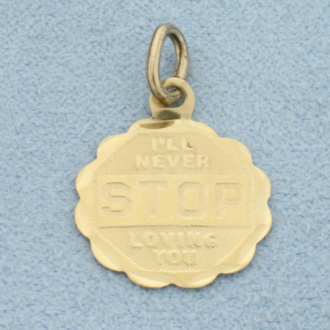 I'LL NEVER STOP LOVING YOU Charm in 14k Yellow Gold: In 14k Yellow Gold. 7/8 inch long. 5/8 inch wide. 0.6g.