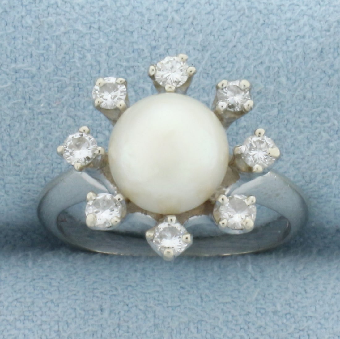Akoya Pearl and Diamond Halo Ring in 14k White Gold: In 14k white gold. Contains one 8mm cultured akoya pear with high luster and creamy undertone. Also contains eighteen high quality diamonds, 1/3ct TW,SI clarity/H color. Size 5.5. 4.6g.