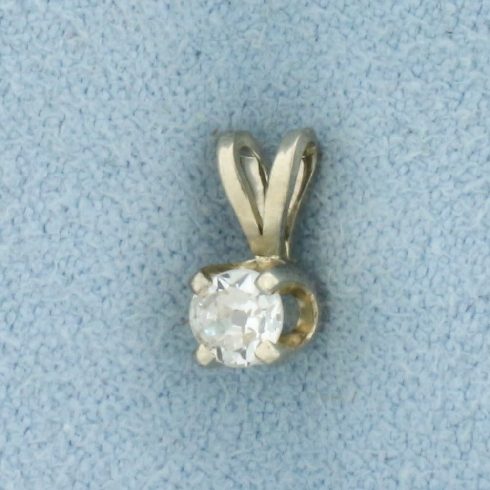 Old European Cut Diamond Solitaire Pendant in 14k White Gold: In 14k White Gold. Contains one high quality 1/5ct old European cut diamond, VS clarity/H color. 5 1/6 inch long. 1/8 inch wide. .4g.