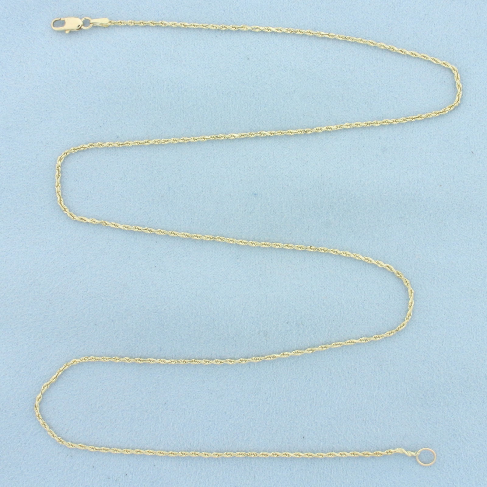 21 Inch Rope Chain Link Necklace in 14k Yellow Gold: In 14k Yellow Gold. 21 inches long. 1.4mm wide. Lobster clasp. 3.7g.