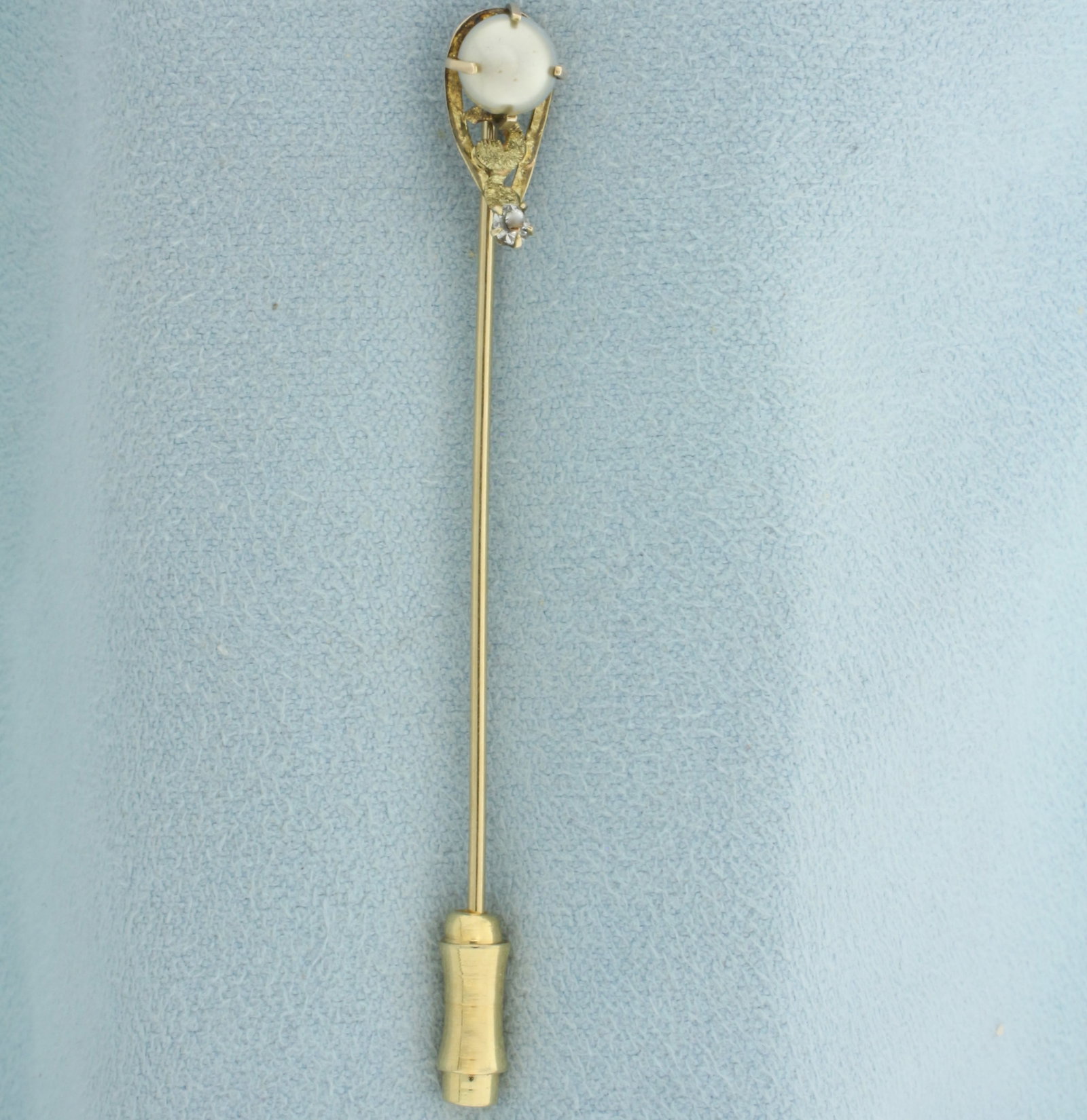 Antique Pearl and White Sapphire Stick Pin in 14k Yellow Gold: In 14k yellow gold. Contains one 5.8mm high quality cultured pearl with silver undertone and high luster. Als contains one high quality .04ct European Cut white sapphire gemstone. 2.5 inches long. 1.3