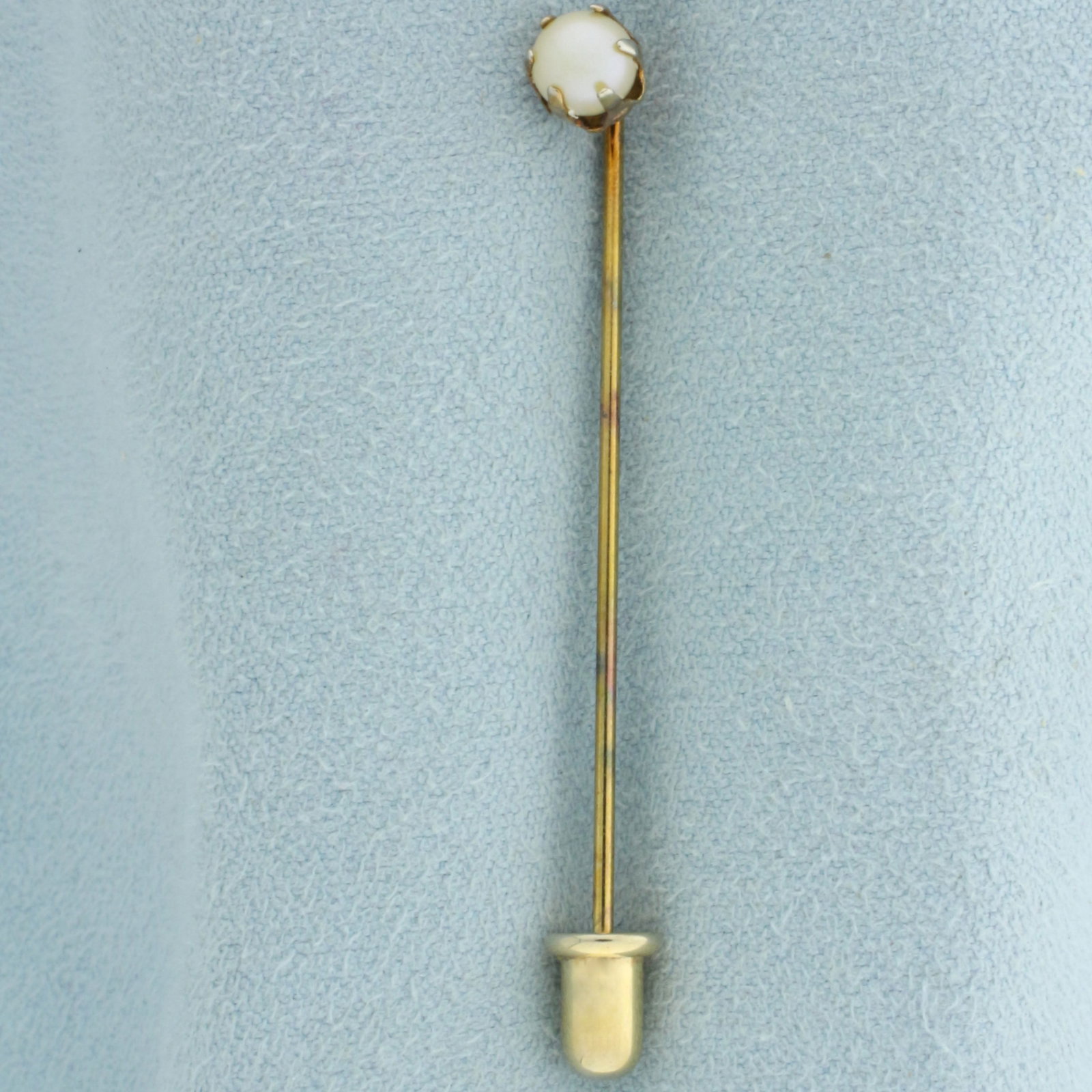 Antique Pearl Stick Pin in 14k Yellow Gold: In 14k yellow gold. Contains one high quality 5mm cultured pearl with high luster. Claw setting. 2 inches long x 3/16 inches wide. .9g.