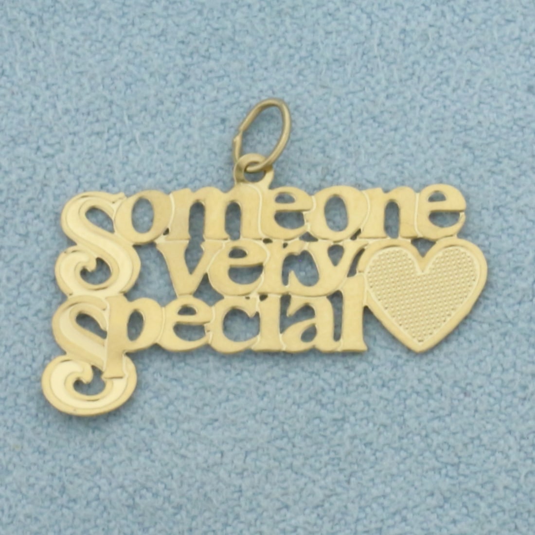 Someone Very Special Pendant or Charm in 14k Yellow Gold: In 14k Yellow Gold. 7/8 inch long. 1/2 inch wide. 0.5g.
