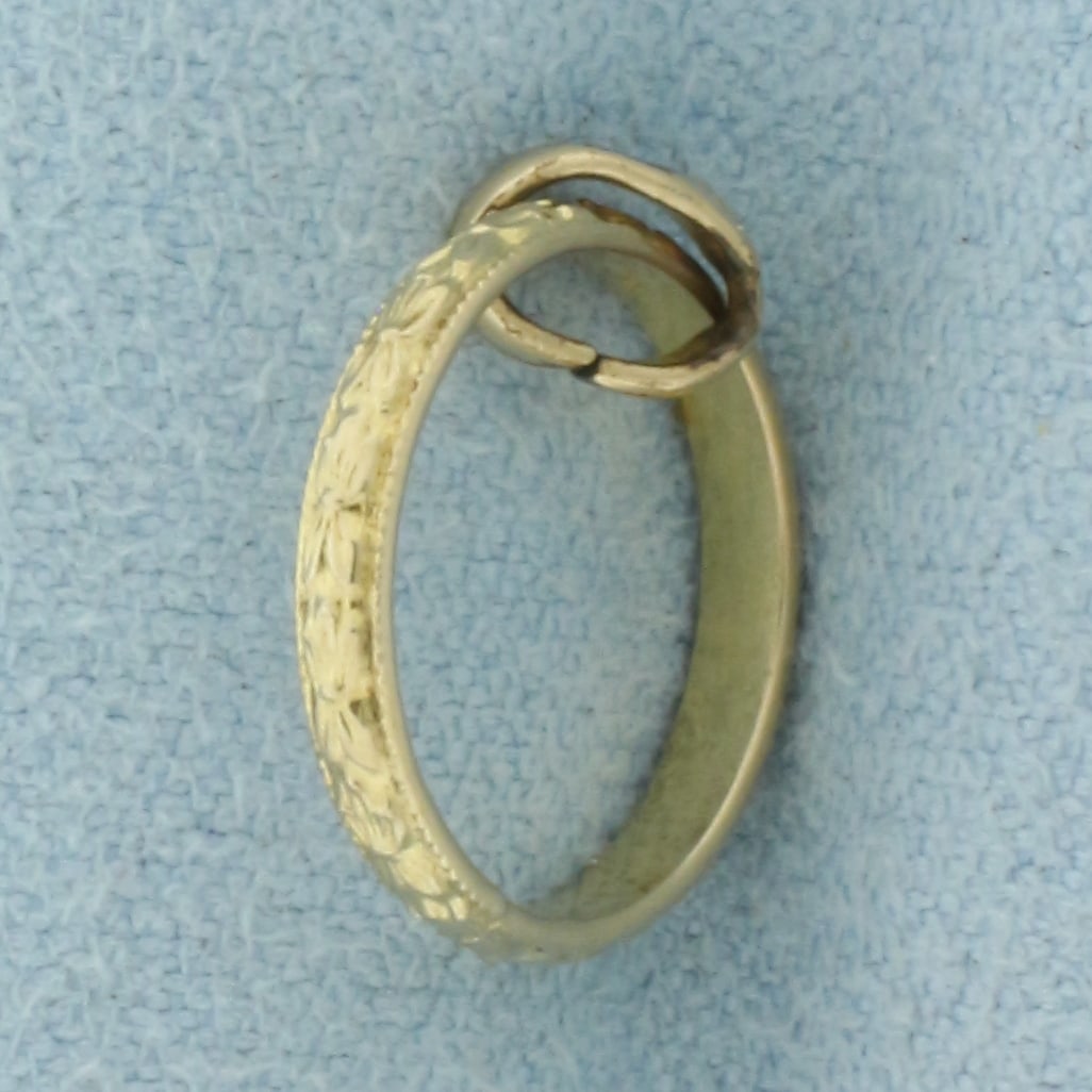 Antique Baby Ring Charm in 10k Yellow Gold: In 10k Yellow Gold. 5/8 inch long. .7g.