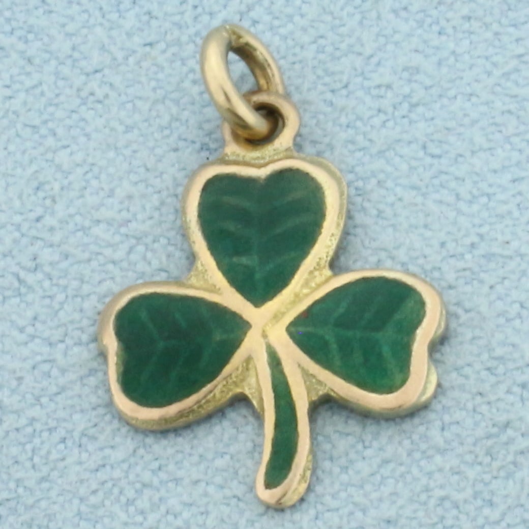 3 Leaf Clover Charm in 9k Yellow Gold: In 9k Yellow Gold. 7/8 inch long including jump ring. 5/8 inch wide at widest. Made in Ireland. 1.5g.