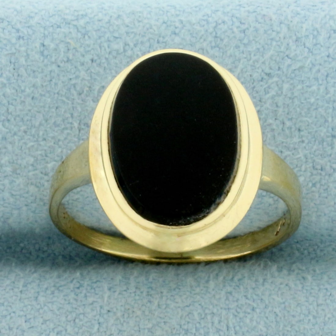 Bezel Set Onyx Ring in 14k Yellow Gold: In 14k Yellow Gold. 14mm oval Onyx gemstone. Size 8. 2.9g.