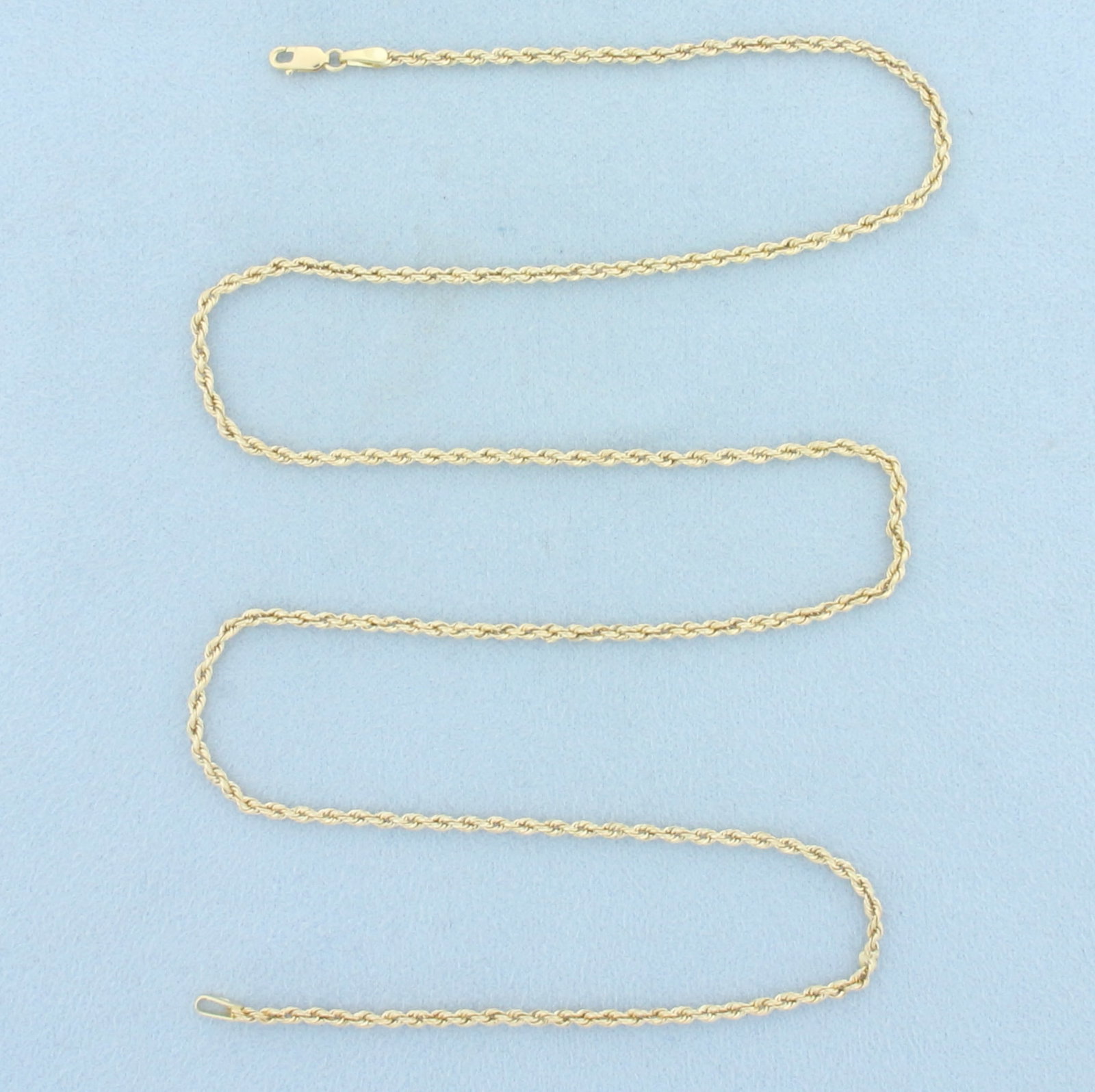 21 Inch Rope Link Chain Necklace in 14k Yellow Gold: In 14k Yellow Gold. 21 inches long. 2mm wide. Lobster clasp. 2.0g.