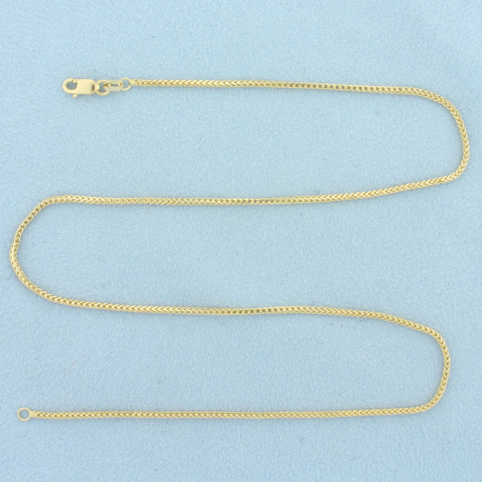 16 Inch Italian Foxtail Wheat Link Chain Necklace in 14k Yellow Gold: In 14k Yellow Gold. 16 inches long. 1.4mm wide. Squared foxtail wheat link. Italian Made . Lobster clasp. 4.4g.
