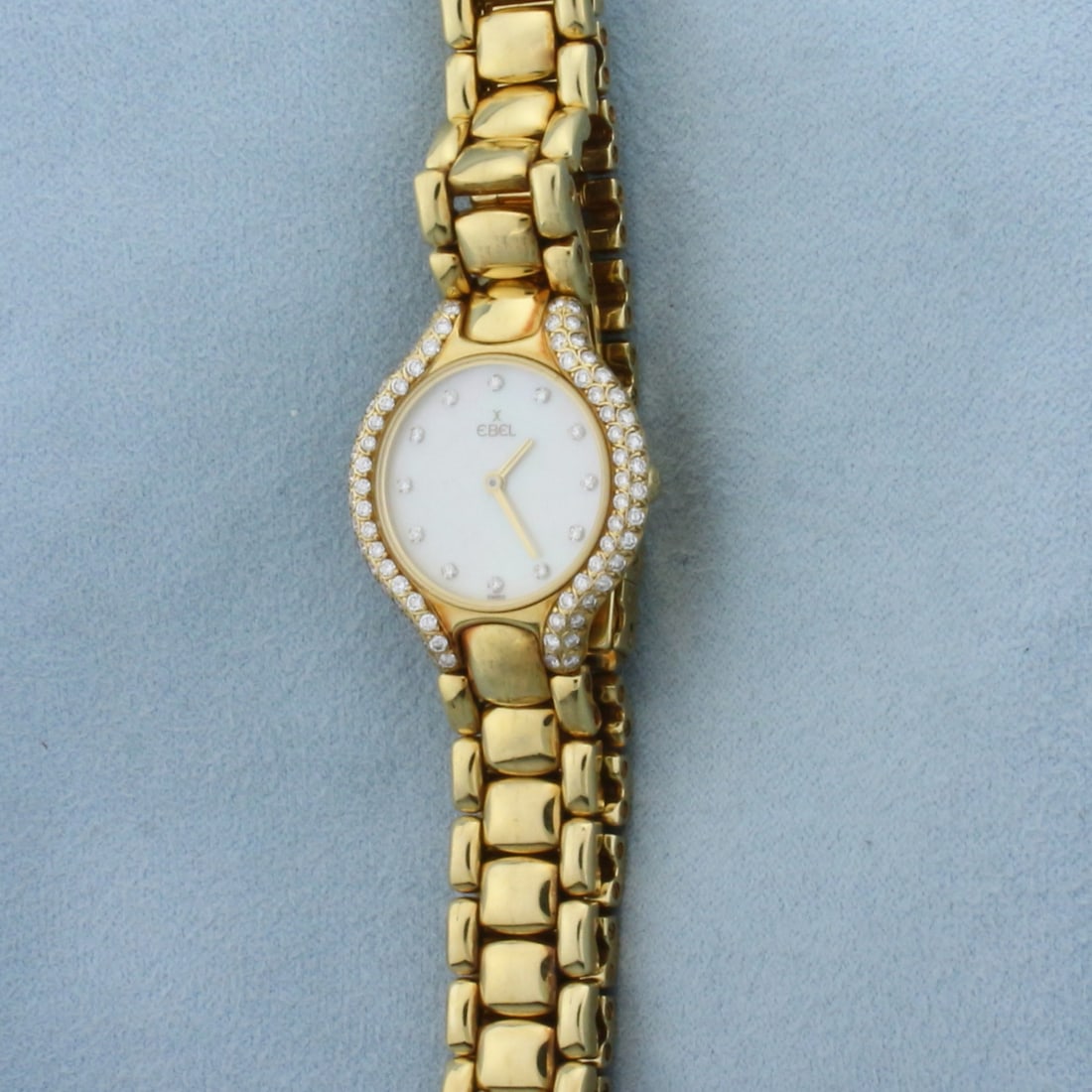 Ladies Ebel Beluga Diamond and Mother of Pearl Watch in Solid 18k Yellow Gold Band and Case: Case and band in solid 18k Yellow Gold. Great condition, no scratching on crystal. Contains 1ct TW of high quality diamonds on case and dial. Swiss quartz movement. New battery, runs great. 24mm case.