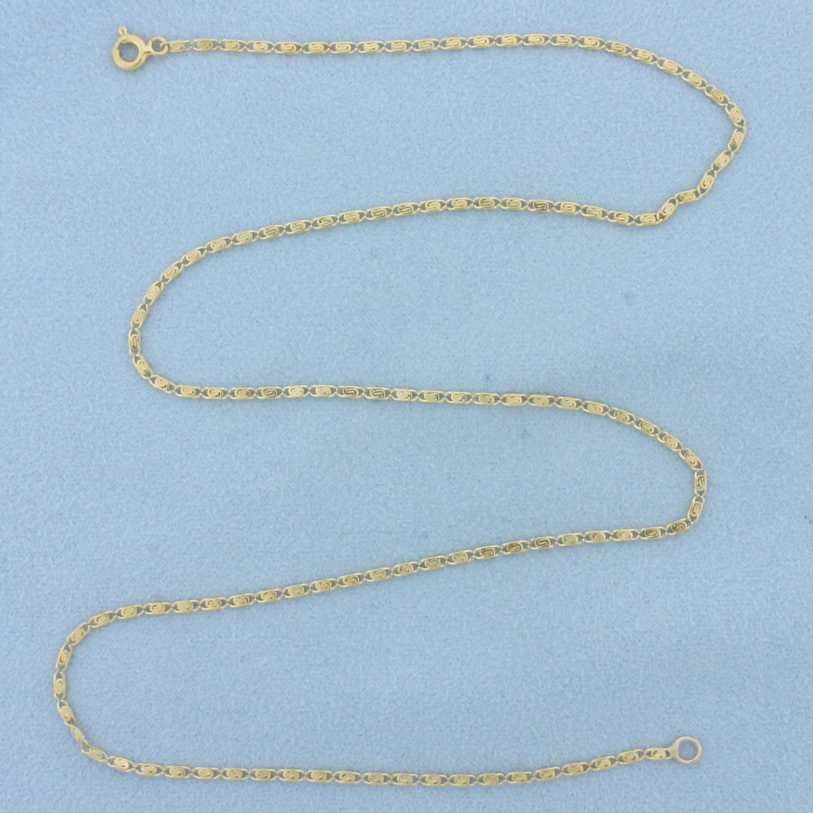 Italian 18 Inch Spiral Link Chain Necklace in 18k Yellow Gold: In 18k yellow gold. Italian made. 18 inches long and 1.6mm wide. Spring clasp. 4.8g.