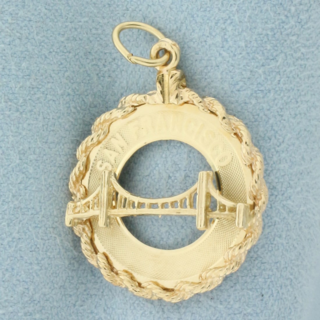 San Francisco Golden Gate Bridge Charm or Pendant in 14k Yellow Gold: In 14k Yellow Gold. 1 1/4 inch long (including jump ring). 3/4 inch wide. 2.8g.