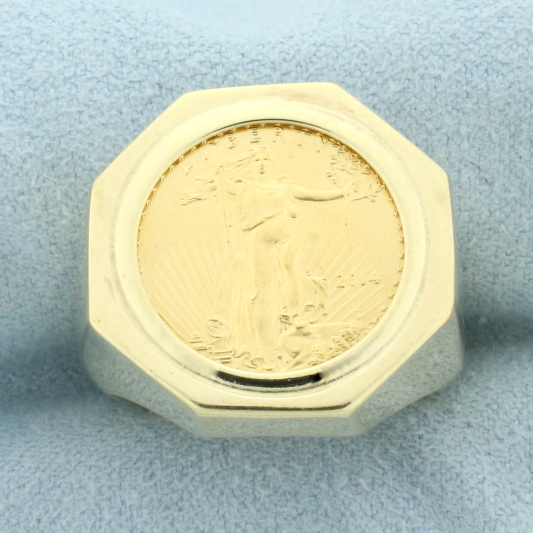 Mens American Eagle Gold Coin Ring in 14k Yellow Gold: In 14k yellow gold mounting. Contains one 2014 1/10oz American Eagle Bullion gold coin made by US Mint. 19.6mm wide at center of ring. Size 9.25. 16.g.