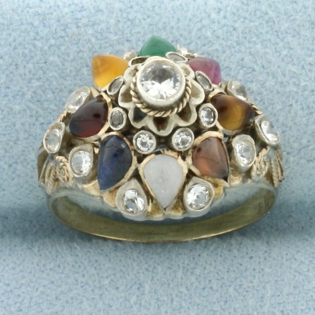 Vintage Rainbow Gemstone Princess Ring in 14k Yellow Gold: In 14k Yellow Gold. Contains high quality 5mm pear cabochon gemstones: amethyst, garnet, citrine, emerald, ruby, tiger eye, tourmaline, and moonstone. Also contains 11 synthetic diamonds. 14.5mm wide.