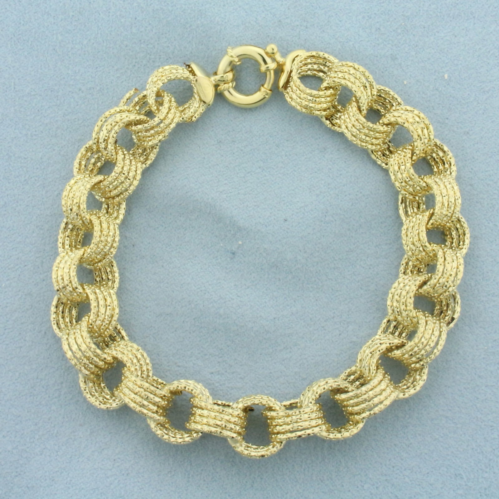Italian Sparkle Cable Link Bracelet in 14k Yellow Gold: In 14k Yellow Gold. Italian made. 8 1/4 inch long. 3/8 inch wide. Sparkle Finish. Oversized toggle spring clasp. 7.4g.