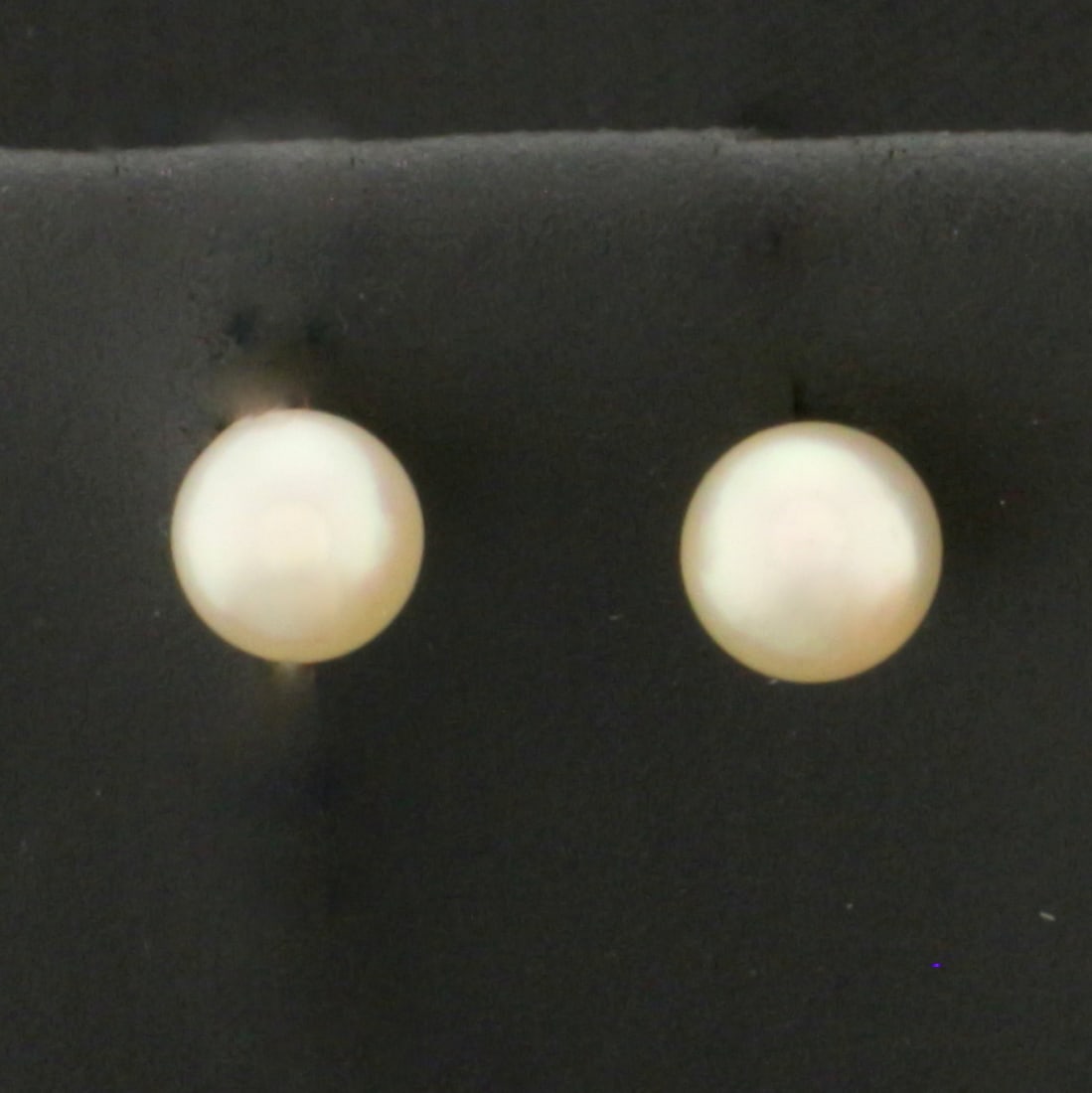 Akoya Pearl Stud Earrings in 14k Yellow Gold: In 14k Yellow Gold. Contains two high quality 5mm cultured akoya pearls with high luster. Friction backs. .7G.
