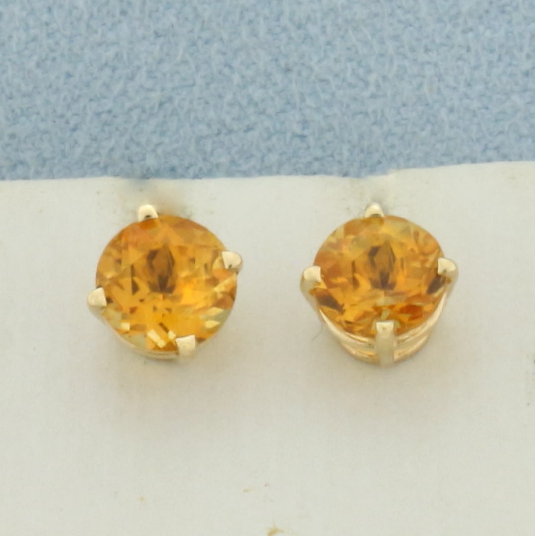 Citrine Stud Earrings in 14k Yellow Gold: In 14k Yellow Gold. Contains two high quality natural 6mm Citrine gemstones, 1.5ct TW, with intense orange color and excellent clarity. Friction backs. 1.0g.