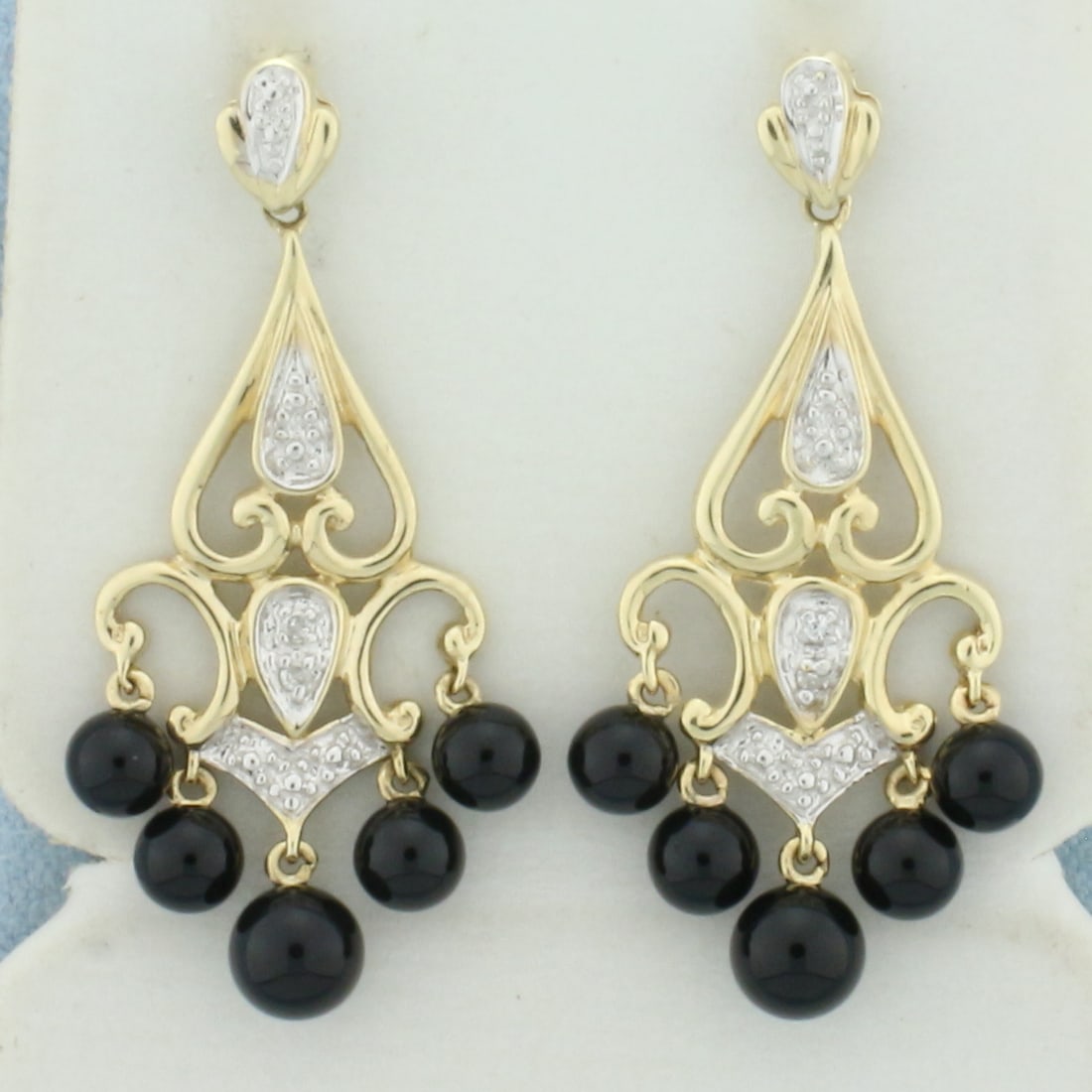 Onyx Dangle Lavalier Chandelier Earrings in 10k Yellow Gold: In 10k Yellow Gold. Contains eight 4mm and two 5mm high quality Onyx gemstones. 1 3/8 inches long. 5/8 inch wide. Friction backs. 4.0g.