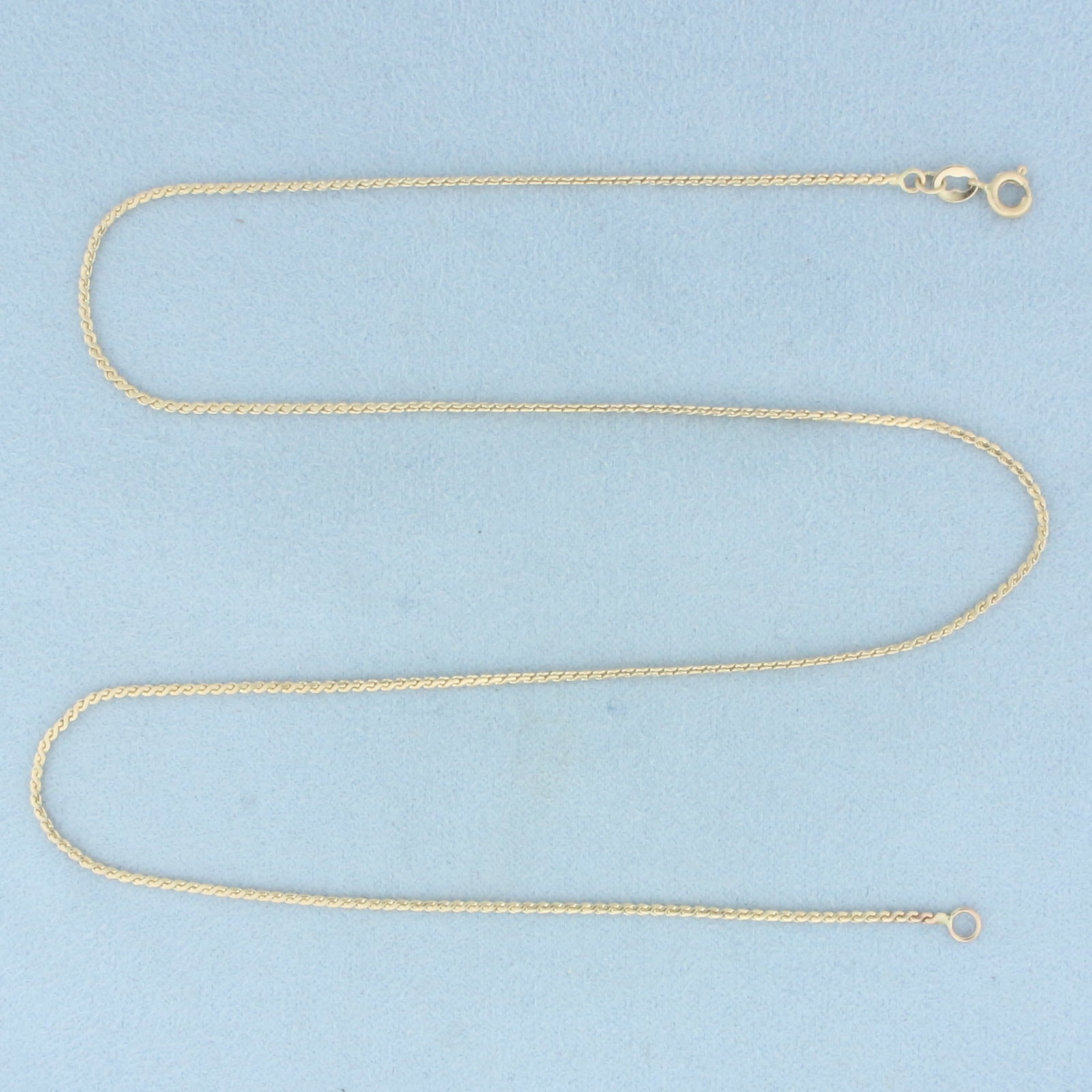 17 Inch S-Link Serpentine Chain Necklace in 10k Yellow Gold: In 10k Yellow Gold. 17 inches long. 1.2mm wide. Spring clasp. 3.2g.