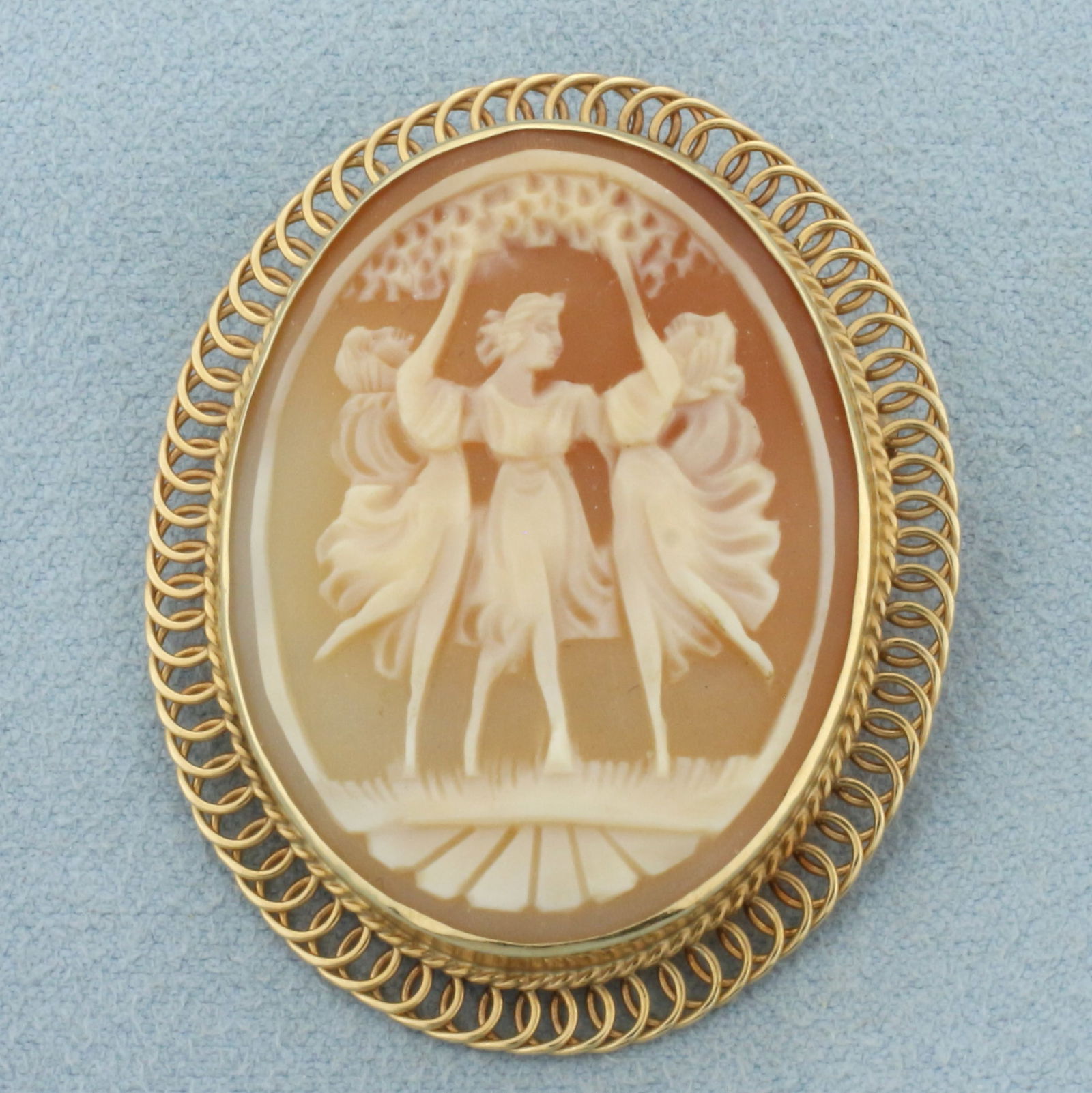 Dancing Three Graces Carved Shell Cameo Pendant or Brooch in 14k Yellow Gold: In 14k yellow gold. Hand carved shell cameo. 1 5/8 inches long x 1 3/8 inches wide. Can be worn as pin or use the swing bale to wear as pendant. 7.5g.