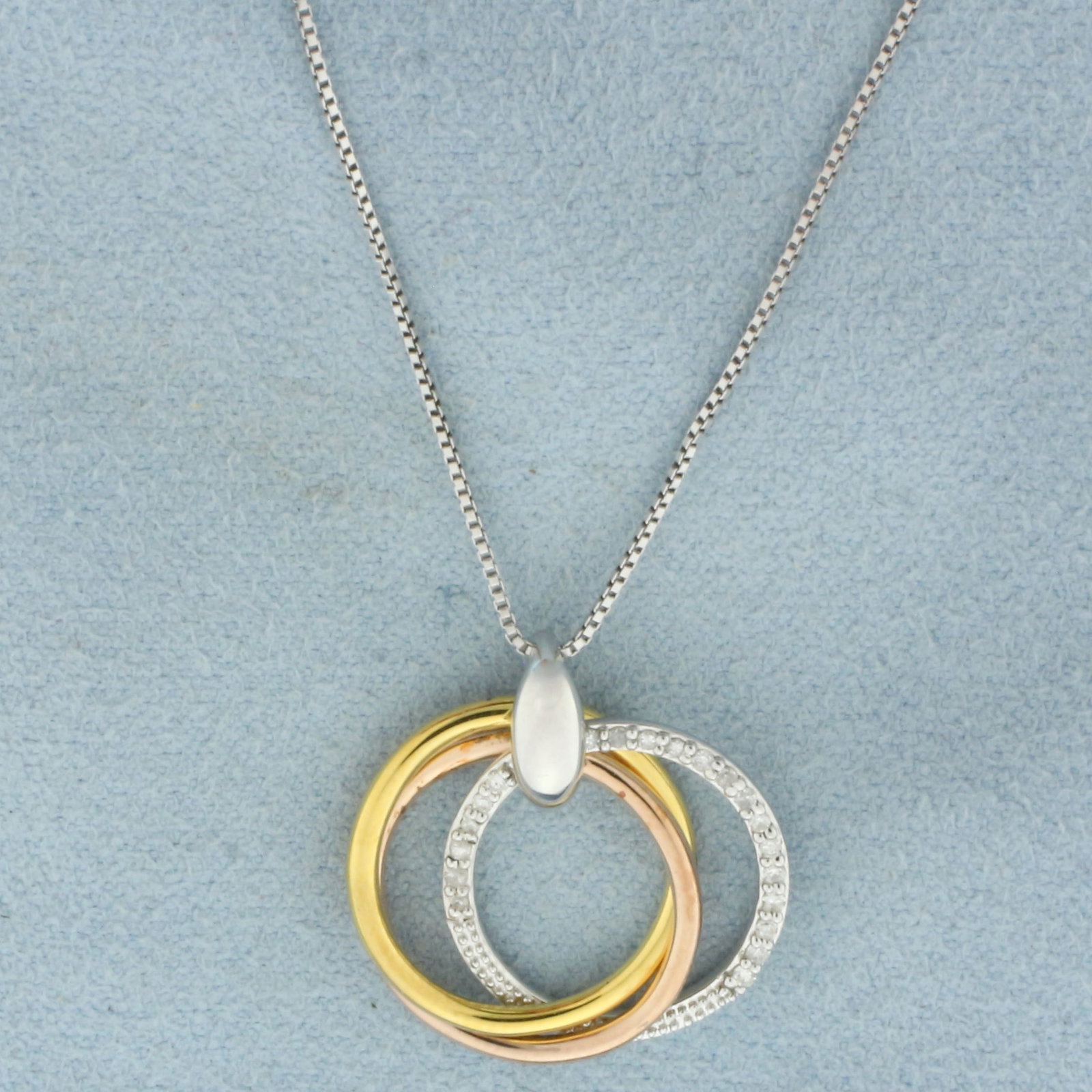Italian Tri-Color Diamond Circle Necklace in Gold Plated Sterling Silver: Italian Gold Plated Sterling Silver. Contains twenty high quality 1/2pt diamonds. Pendant is 3/4 inch long by 3/4 inch wide. Box link chain is 18 inch long,. .6mm wide. 3.4g.