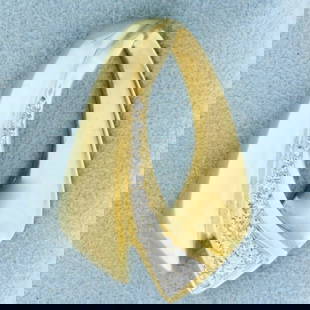 Abstract Design Diamond Pendant or Slide in 14K Yellow Gold: In 14K Yellow Gold. Contains eighteen high quality diamonds ranging from 1/2pt to .03cts each, VS clarity/G color. 1/4ct TW. 1 1/4 inches long. 5.5g